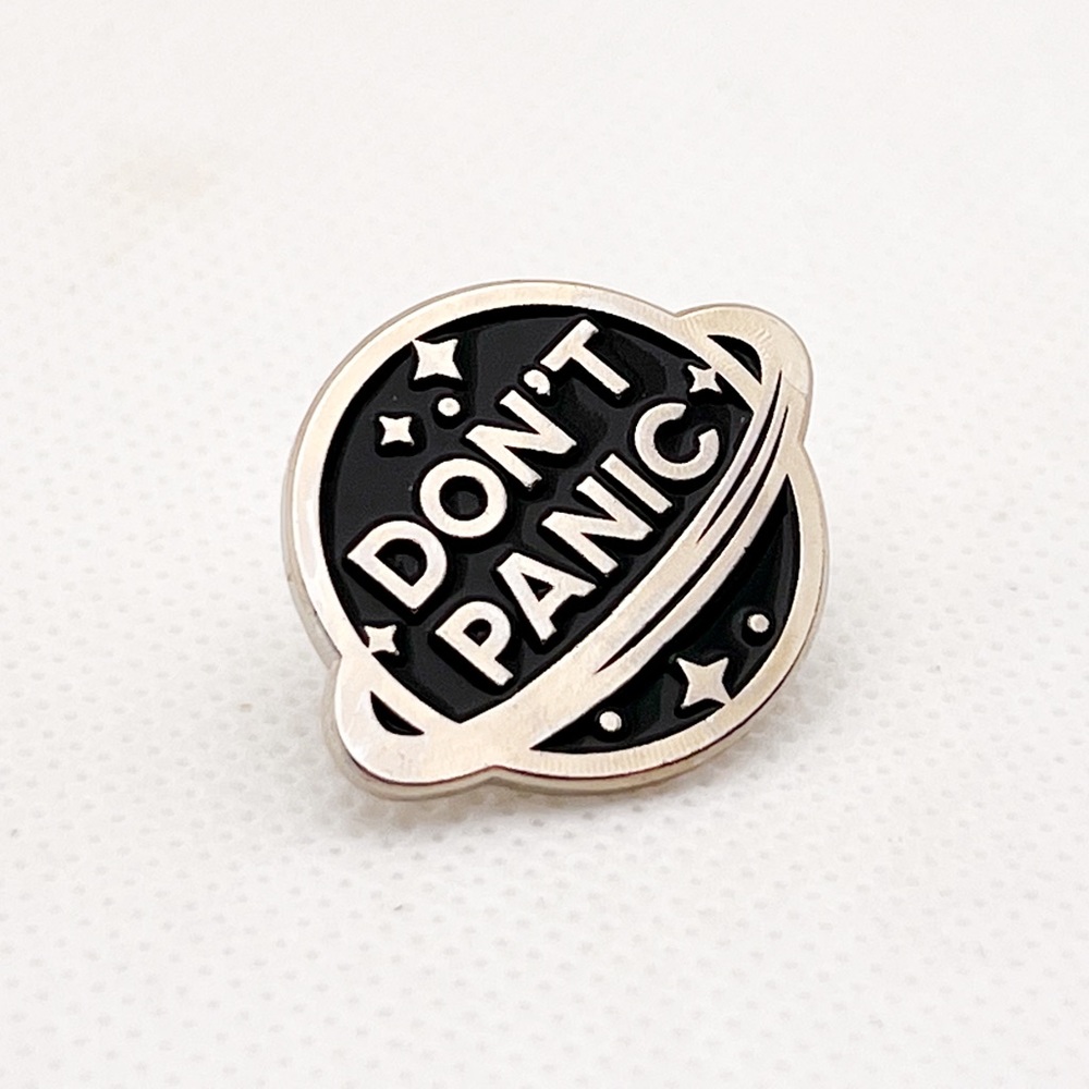 silver "don't panic" pin
